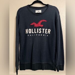 Hollister Men's Dark Blue Sweater with Red Emblem